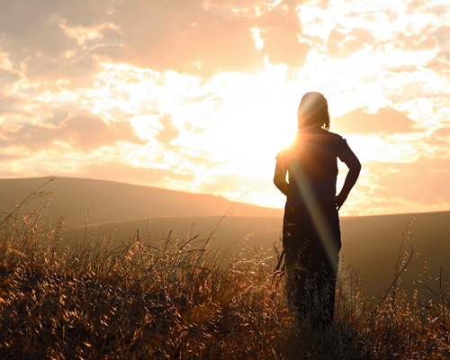 woman faces sunset