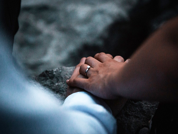 Blurred joined hands 600x450